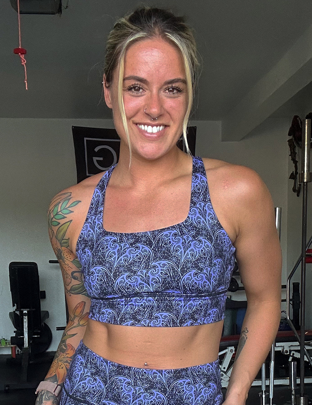 model wearing the purple bat lace sports bra