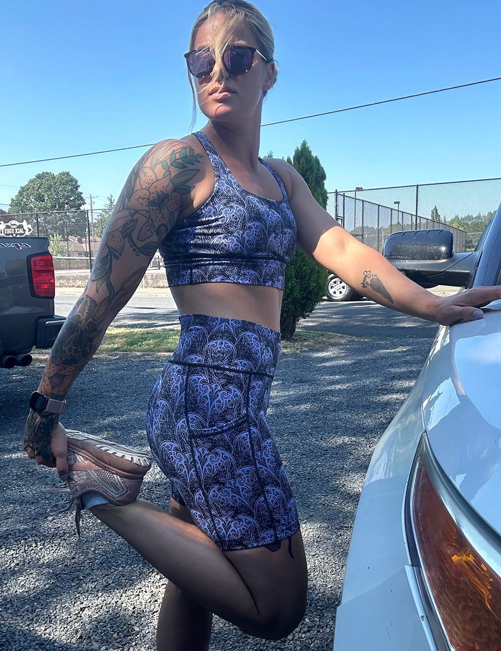 model wearing the purple bat lace 5 inch shorts and sports bra