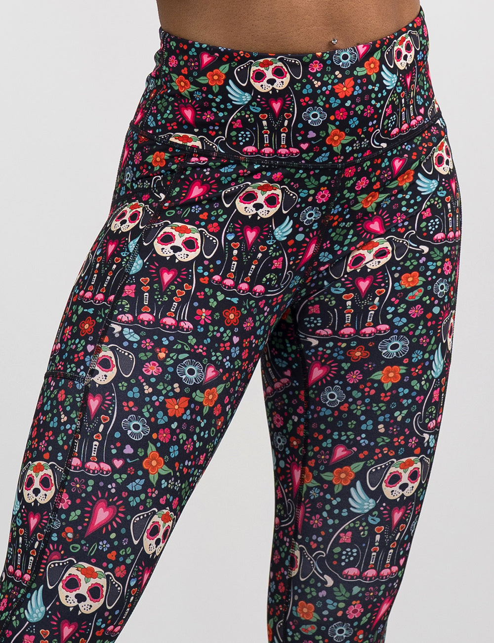 front of the skeleton dogs surrounded by flowers leggings against a white background