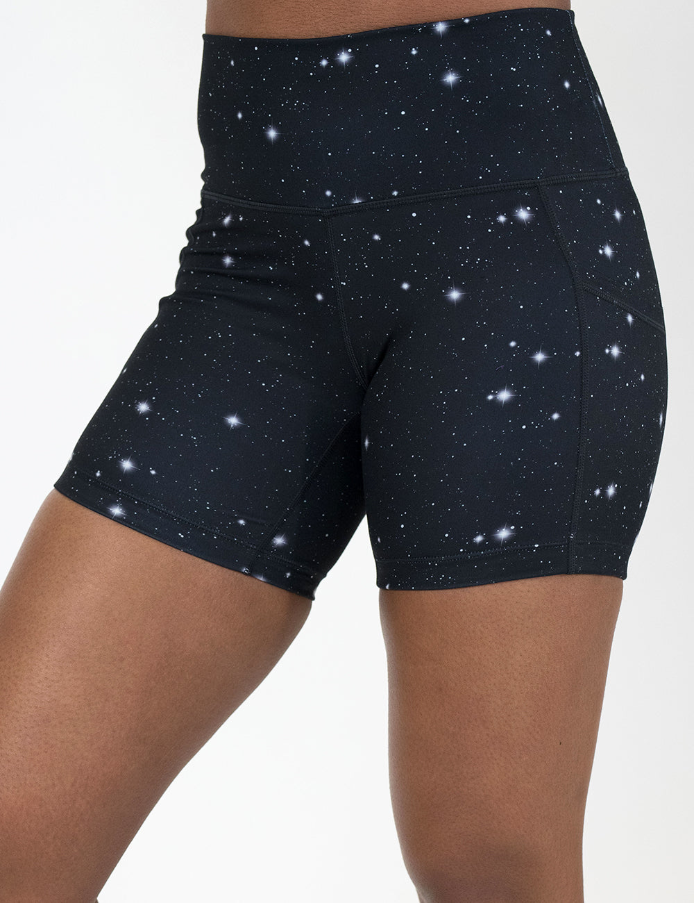 front of the 5 inch black shorts with a white star pattern on it against a white background