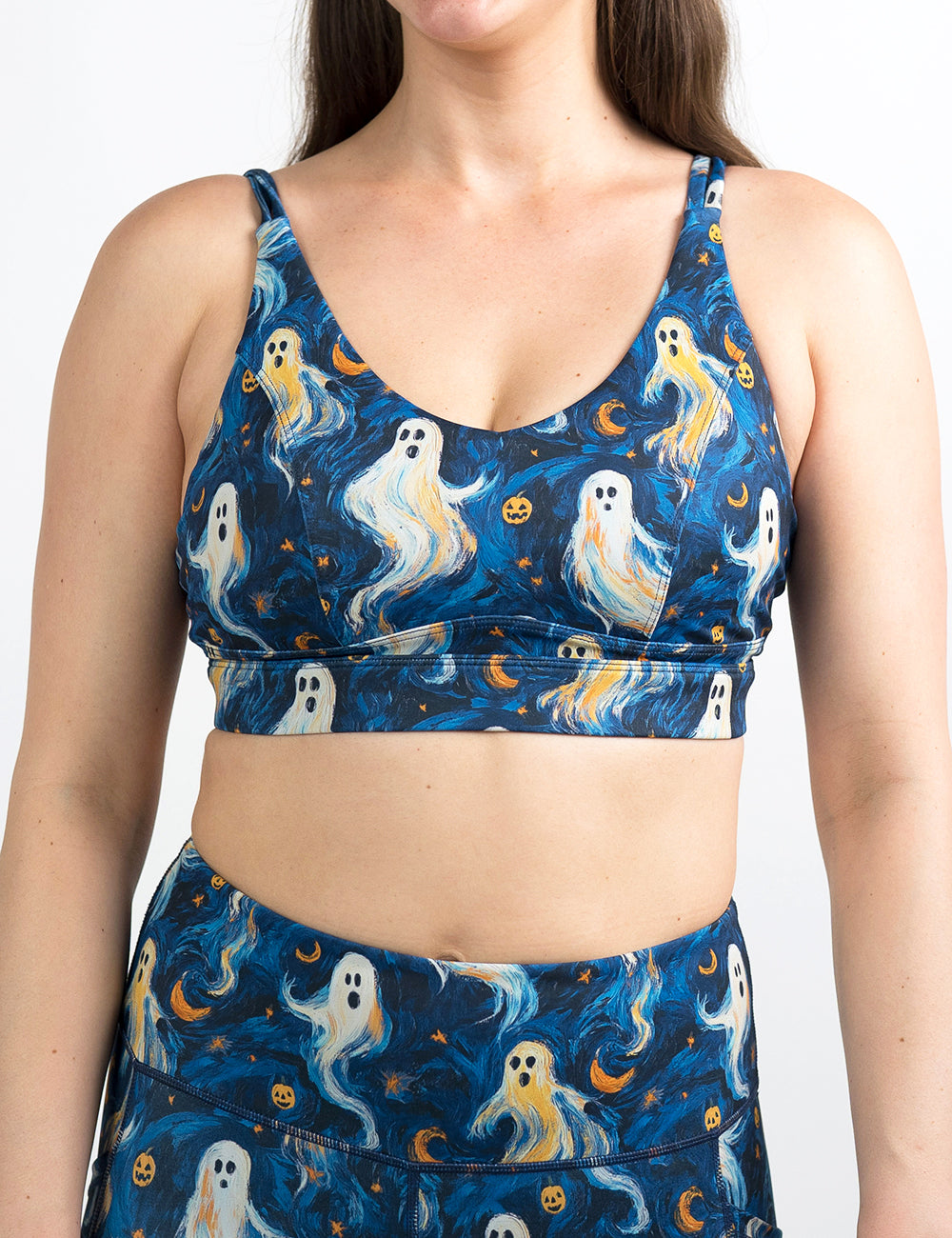 front of the starry night ghosts against a blue background pattern bra against a white background