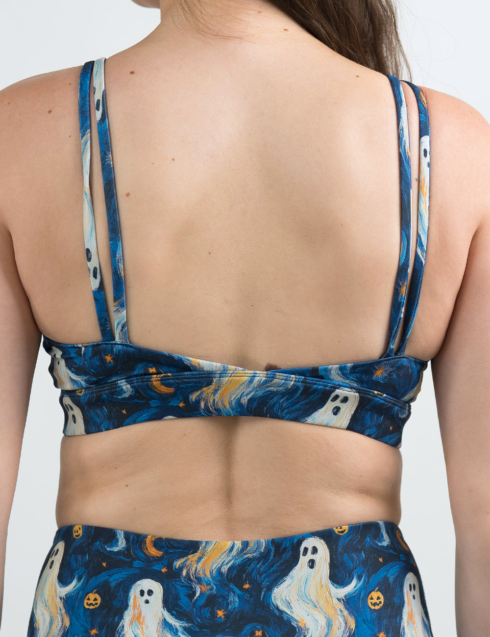 back of the starry night ghosts against a blue background pattern bra against a white background