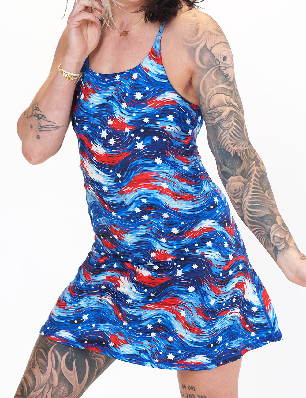 front of the red, white, and blue wavy dress with white stars against a white background