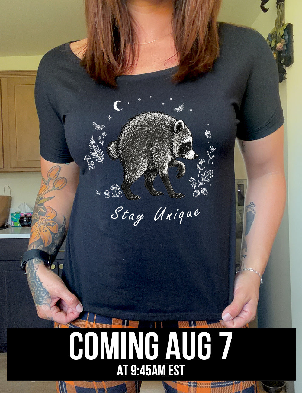 front of the black "stay unique" raccoon  slouchy tee coming soon