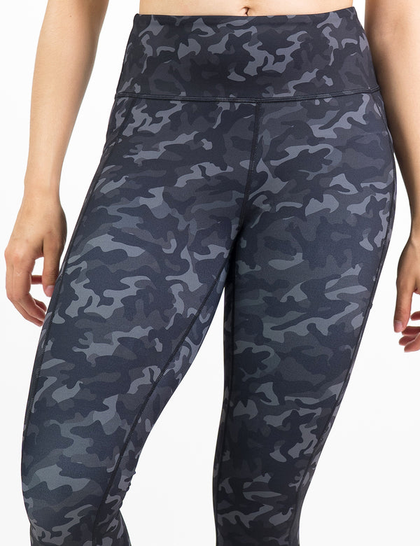 front of the black camo print leggings against a white background