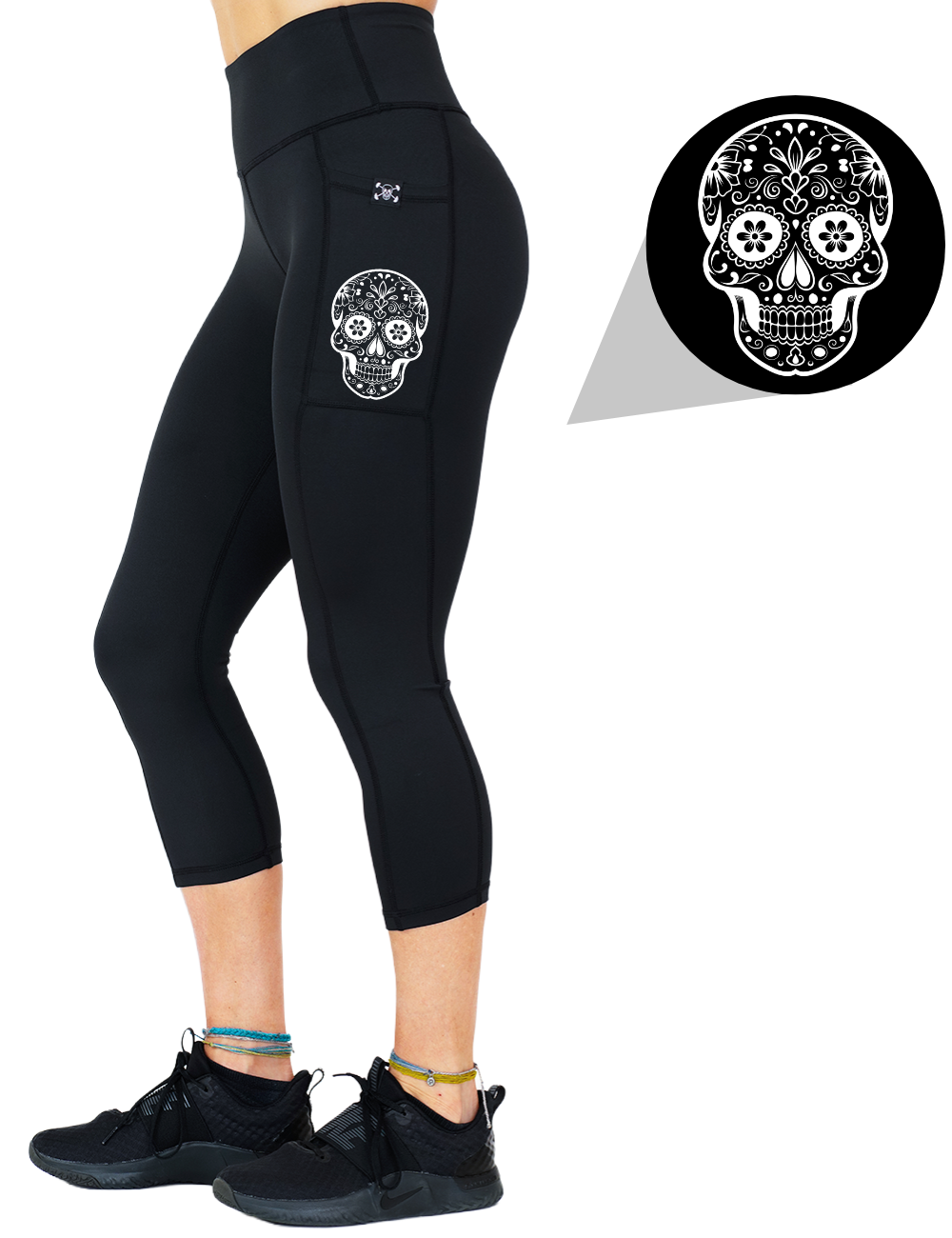model wearing the skull outline graphic capri solid black leggings against a white background