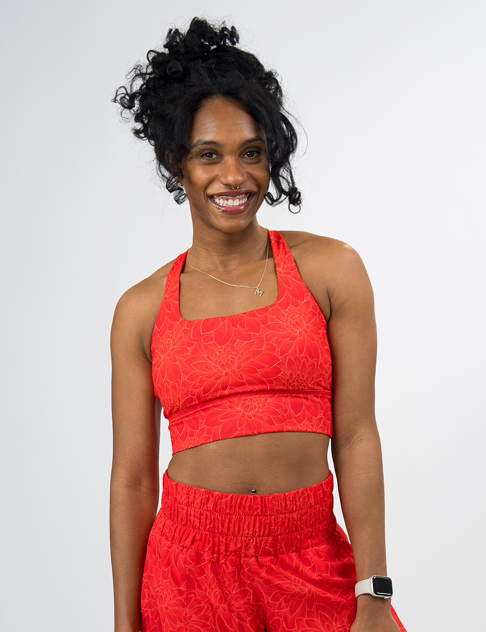 model wearing the orange etched lotus longline bra against a white background
