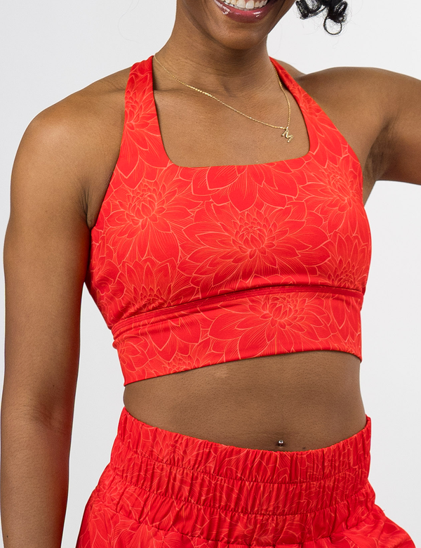 front of the orange lotus longline bra against a white background