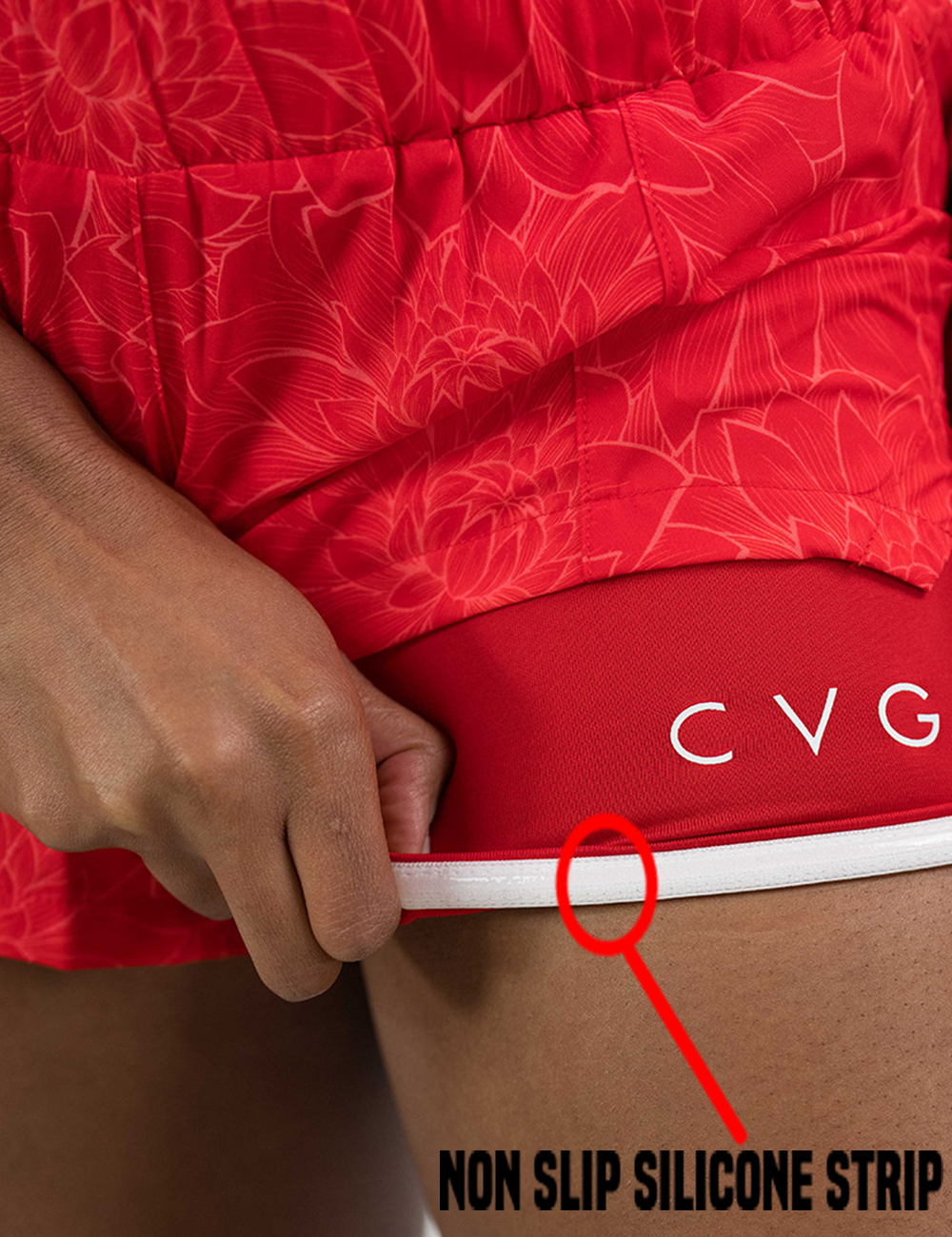 orange lotus day dream shorts pulled up to show the non slip silicone strip found in the shorts lining