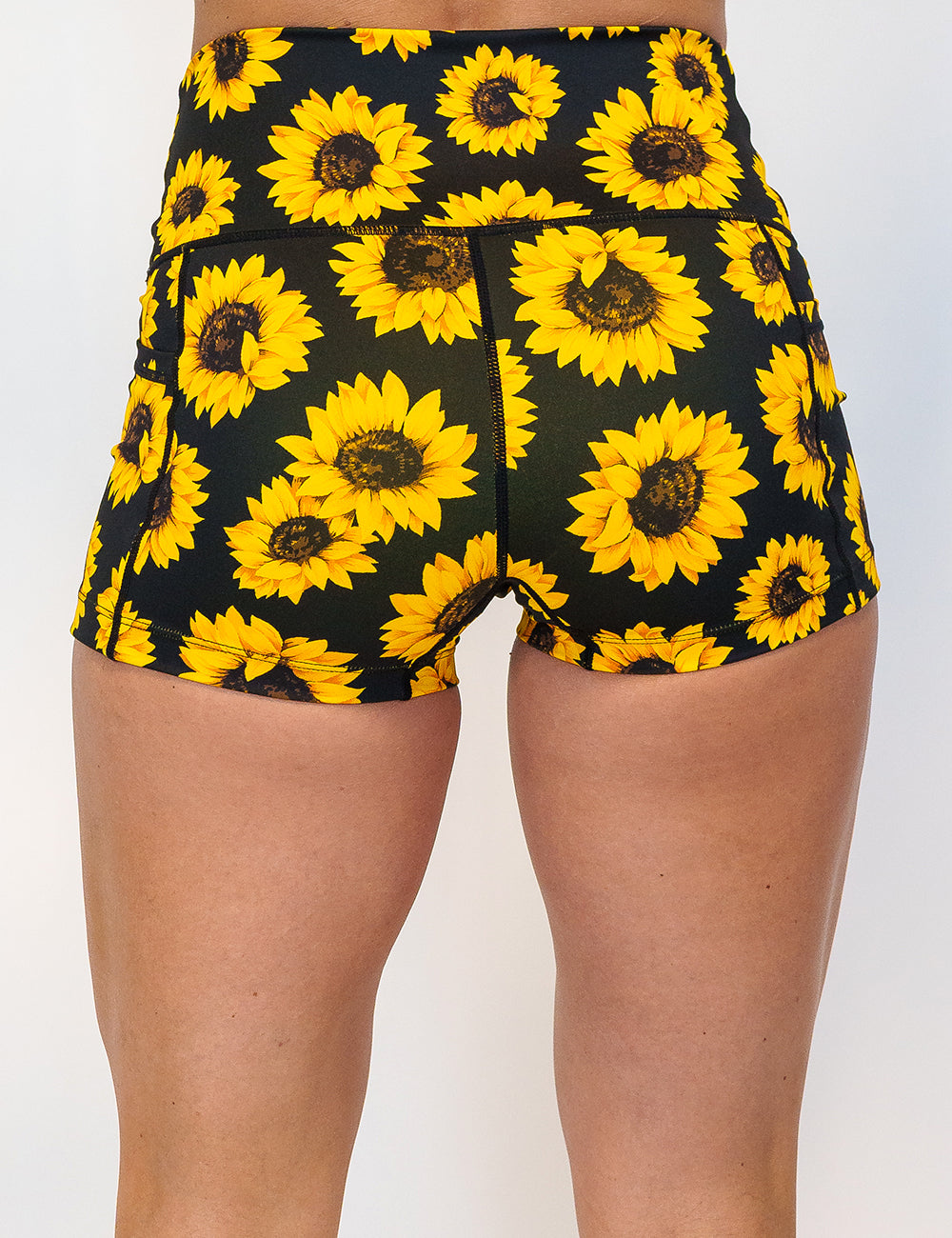 back of the 2.5 inch yellow flower shorts against a white background
