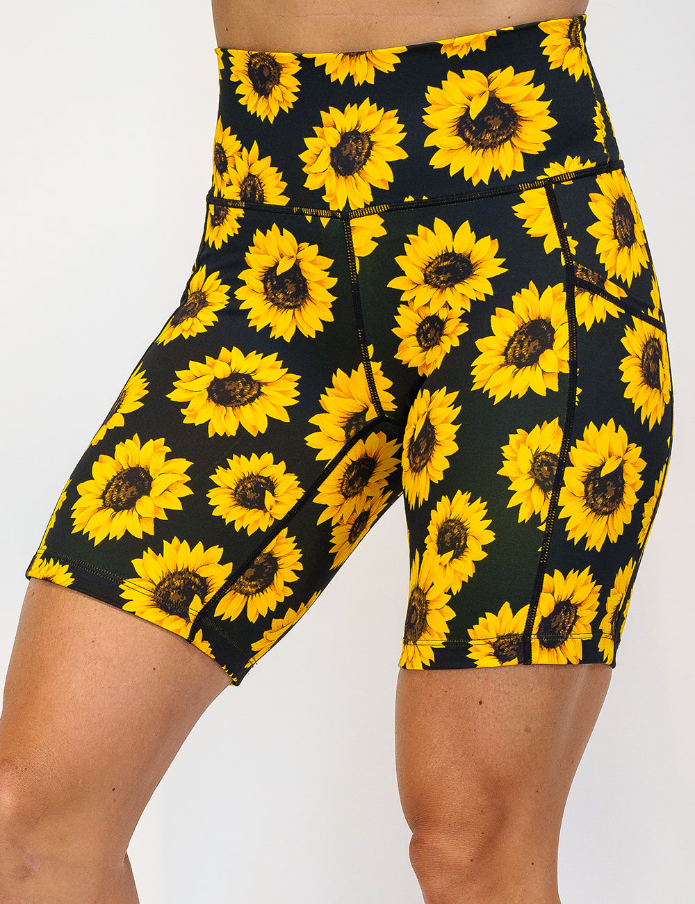 front of the 7 inch yellow flower shorts against a white background