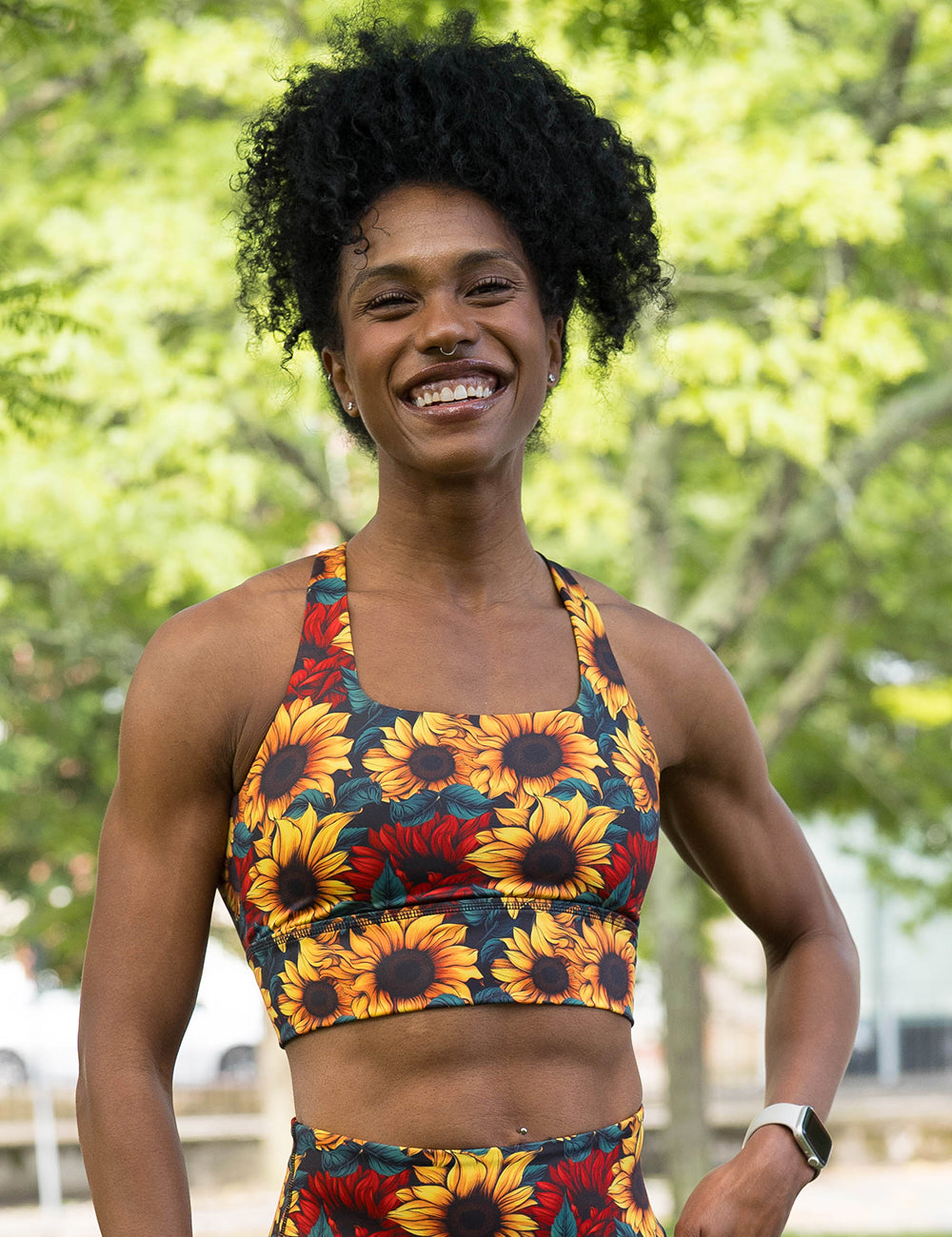 model wearing the sunflower with red flowers bra