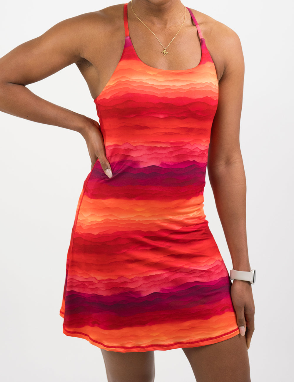 model wearing a sunset colored dress