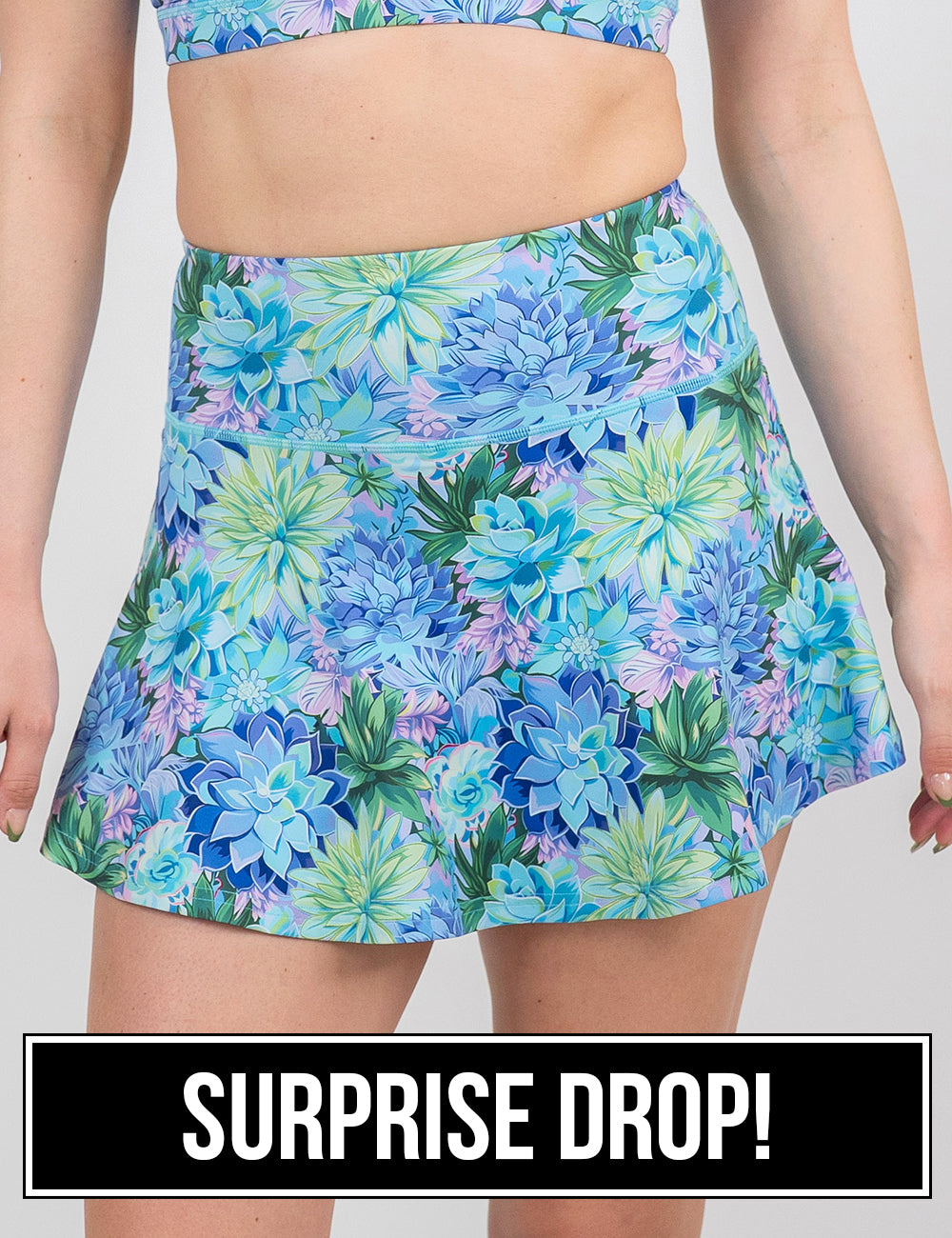 front of the regular length blue flowers skirt against a white background, surprise drop
