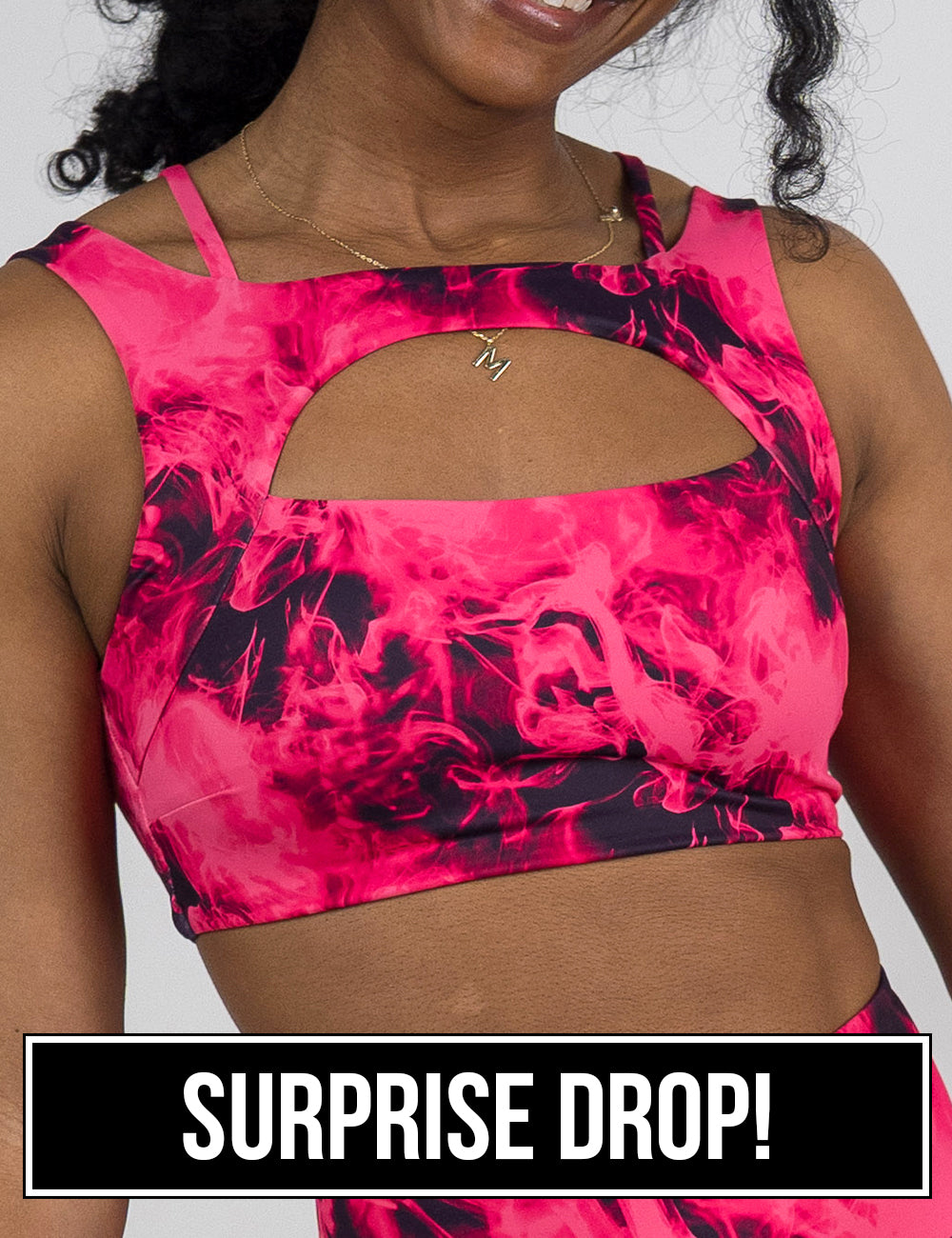 front of the pink smoke pattern vista bra against a white background, surprise drop