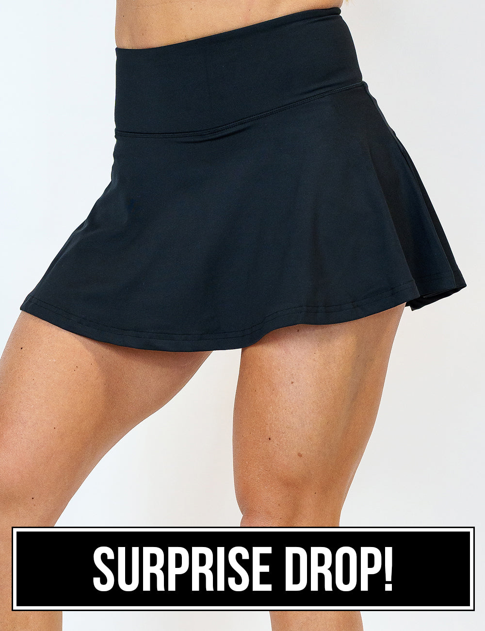 front of the regular length black skirt against a white background, surprise drop
