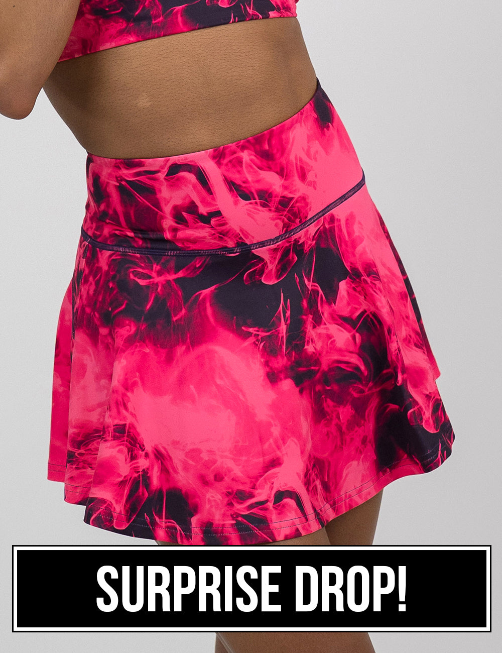 front of the regular length pink smoke pattern skirt against a white background, coming soon
