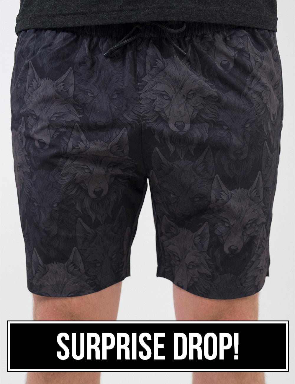 front of the black men's shorts with grey wolves against a white background, surprise drop