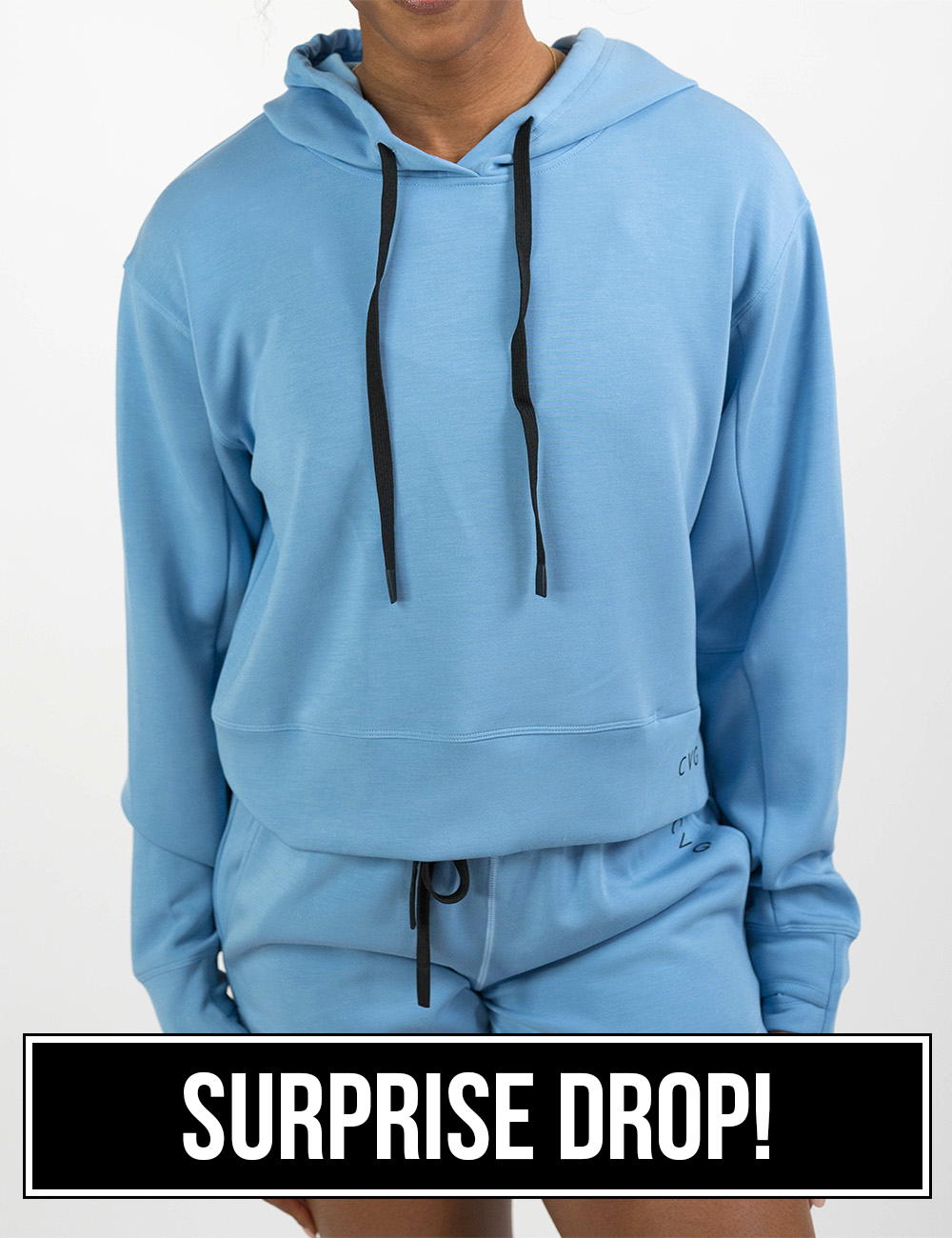light blue sweat shirt with black drawstrings facing the front against a white background coming soon