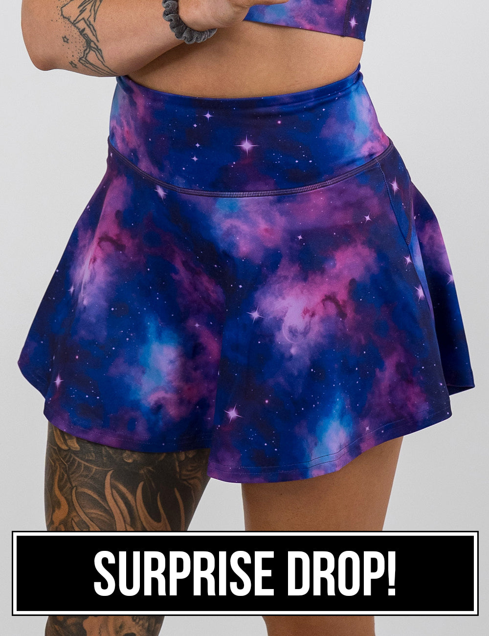 front of the purple and blue cosmos pattern regular length skirt against a white background, surprise drop