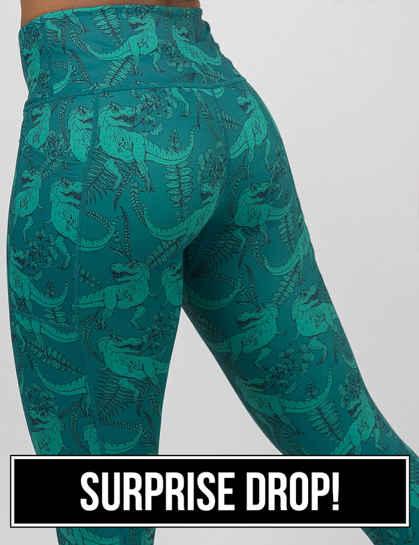 back of the teal t-rex pattern leggings against a white background, surprise drop