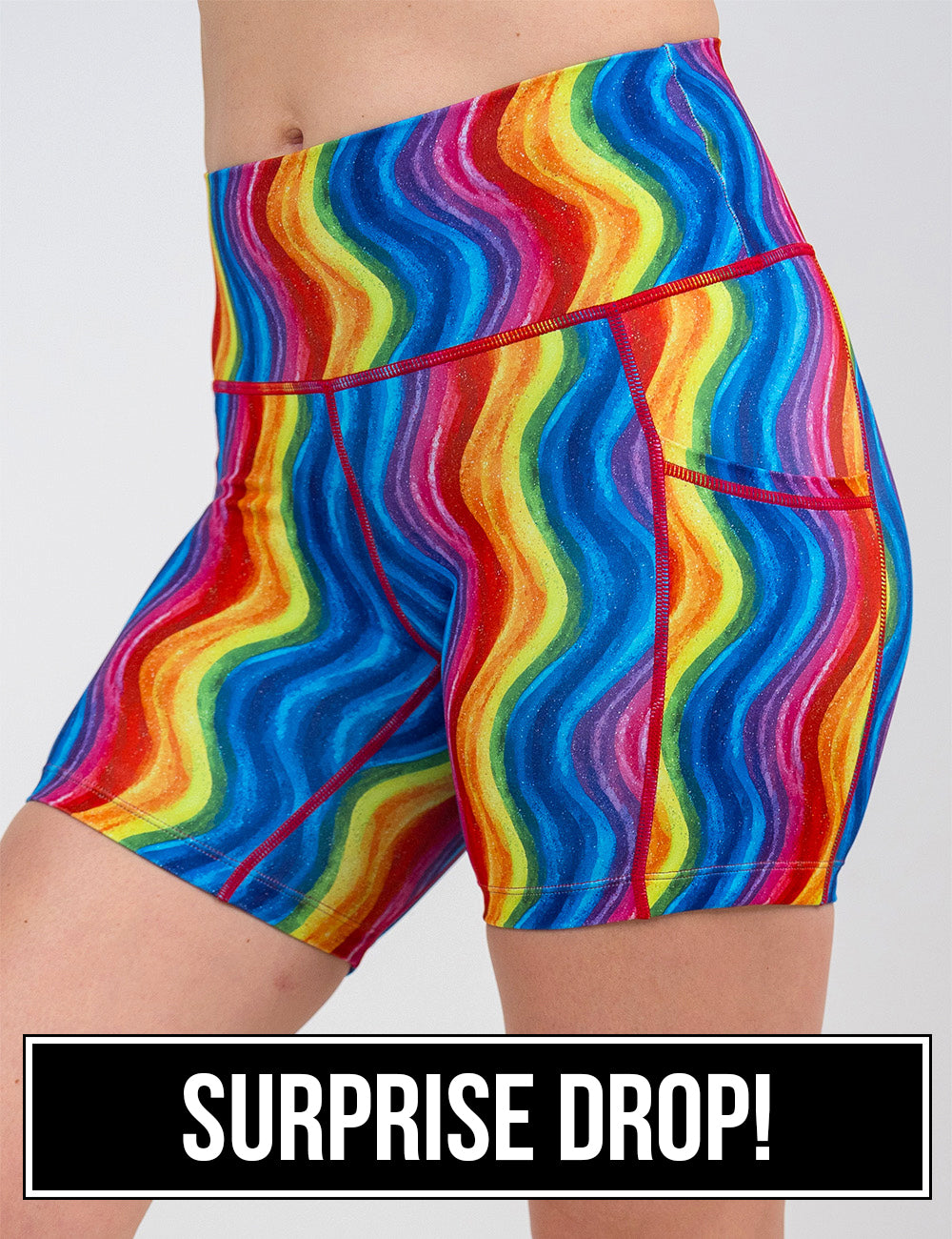 front of the 5 inch rainbow waves shorts against a white background, surprise drop