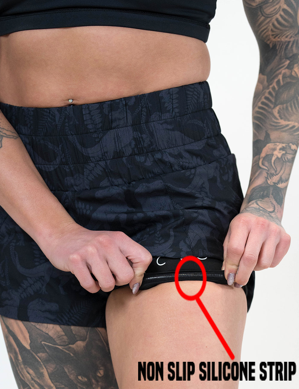 close up of the dark grey trex day dream shorts rolled up to show the non slip silicone strip lining found inside of the under shorts