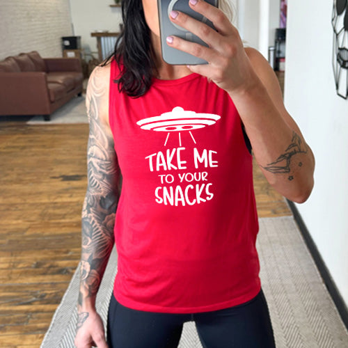 red muscle tank top with a white quote on it that says "take me to your snacks" with a ufo on top of it 