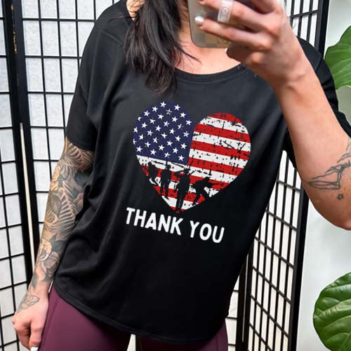 model wearing the black "Thank You Flag Heart" Slouchy Tee