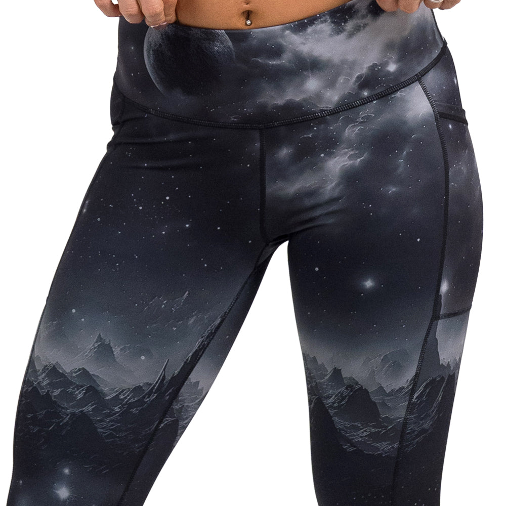 Black leggings with mountain and star pattern on a white background