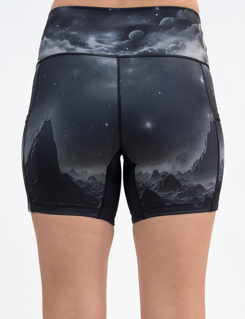 back of the 5 inch dark mountains in space shorts against a white background