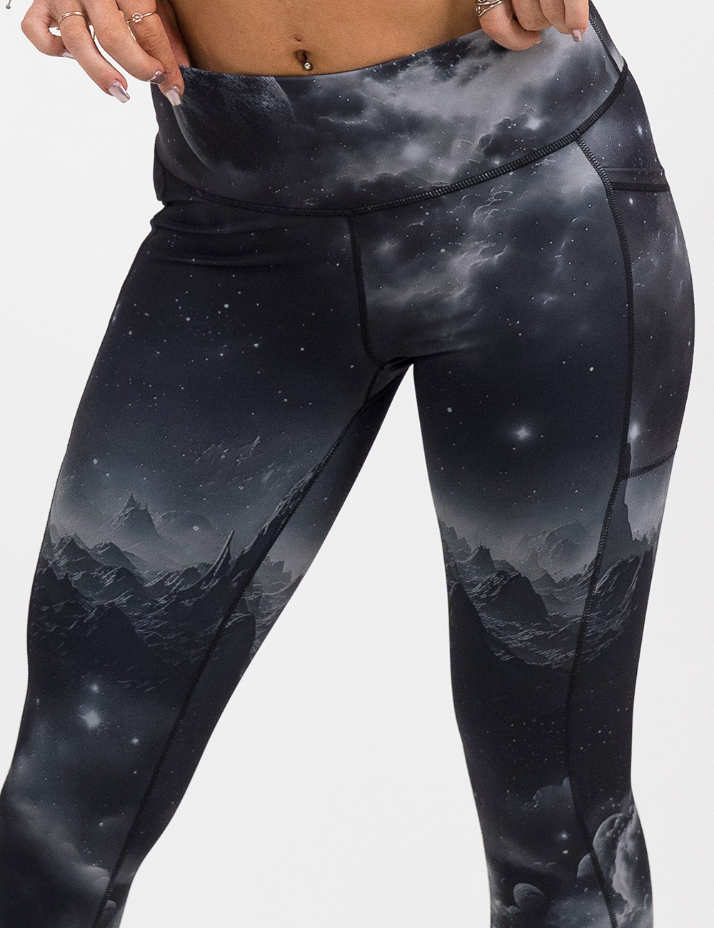 Black leggings with mountain and star pattern on a white background