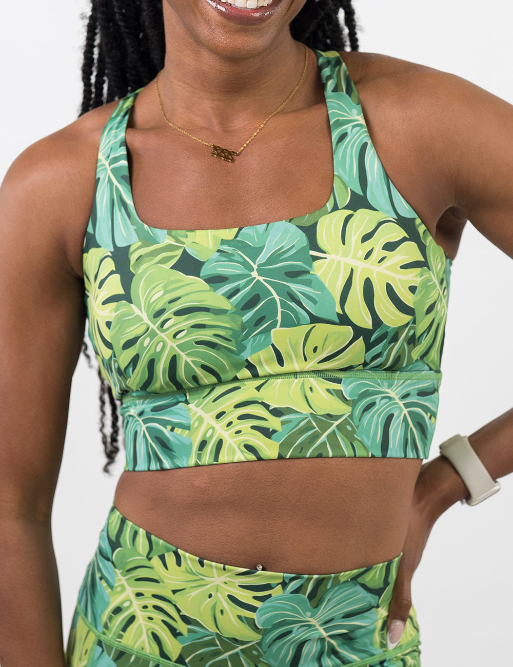 front of the vibrant tropical leaves shorts against a white background