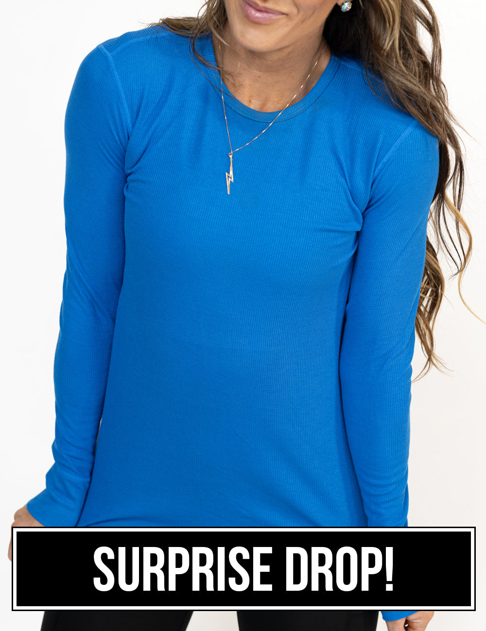 front of the bright blue thermal against a white background, surprise drop