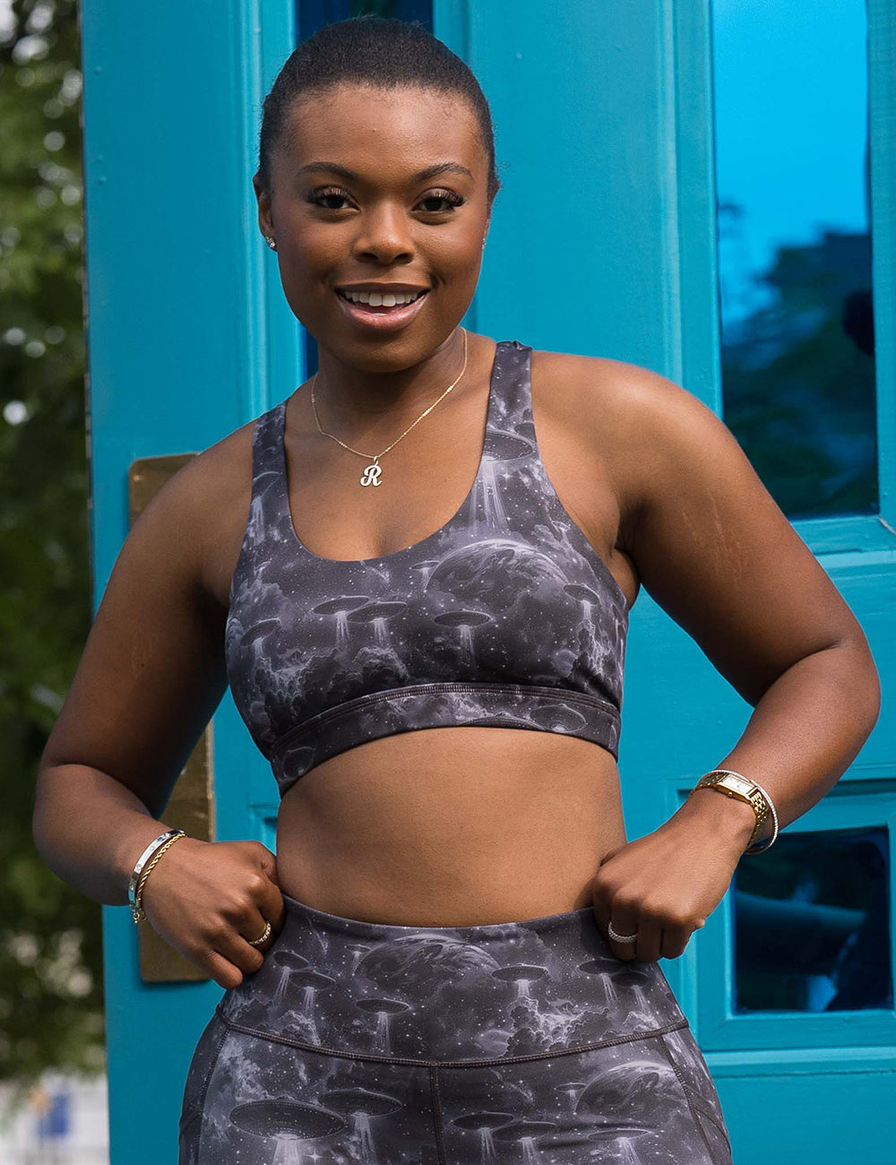 model wearing the alien space ship invasion sports bra and matching leggings