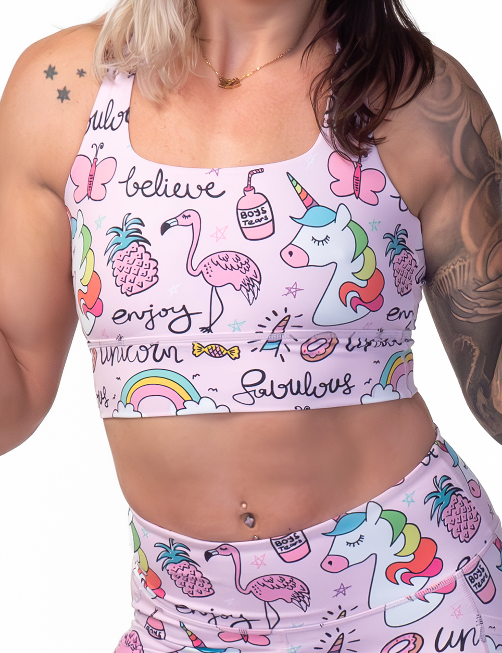 front of the unicorn and icons pink bra against a white background