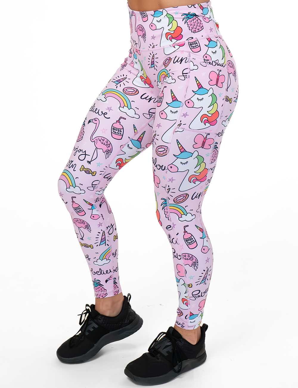 model wearing the full length the pink unicorn and colorful icons print leggings against a white background