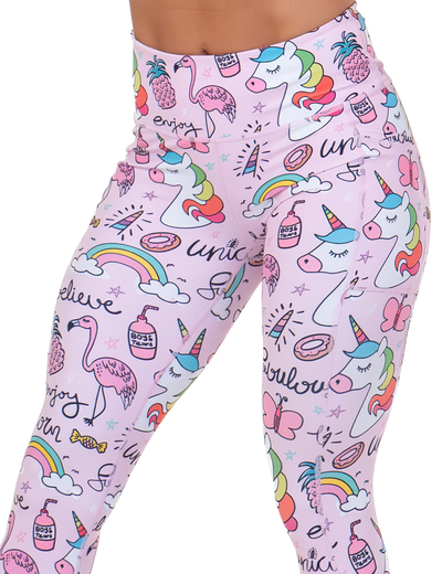 front of the pink unicorn and colorful icons print leggings against a white background