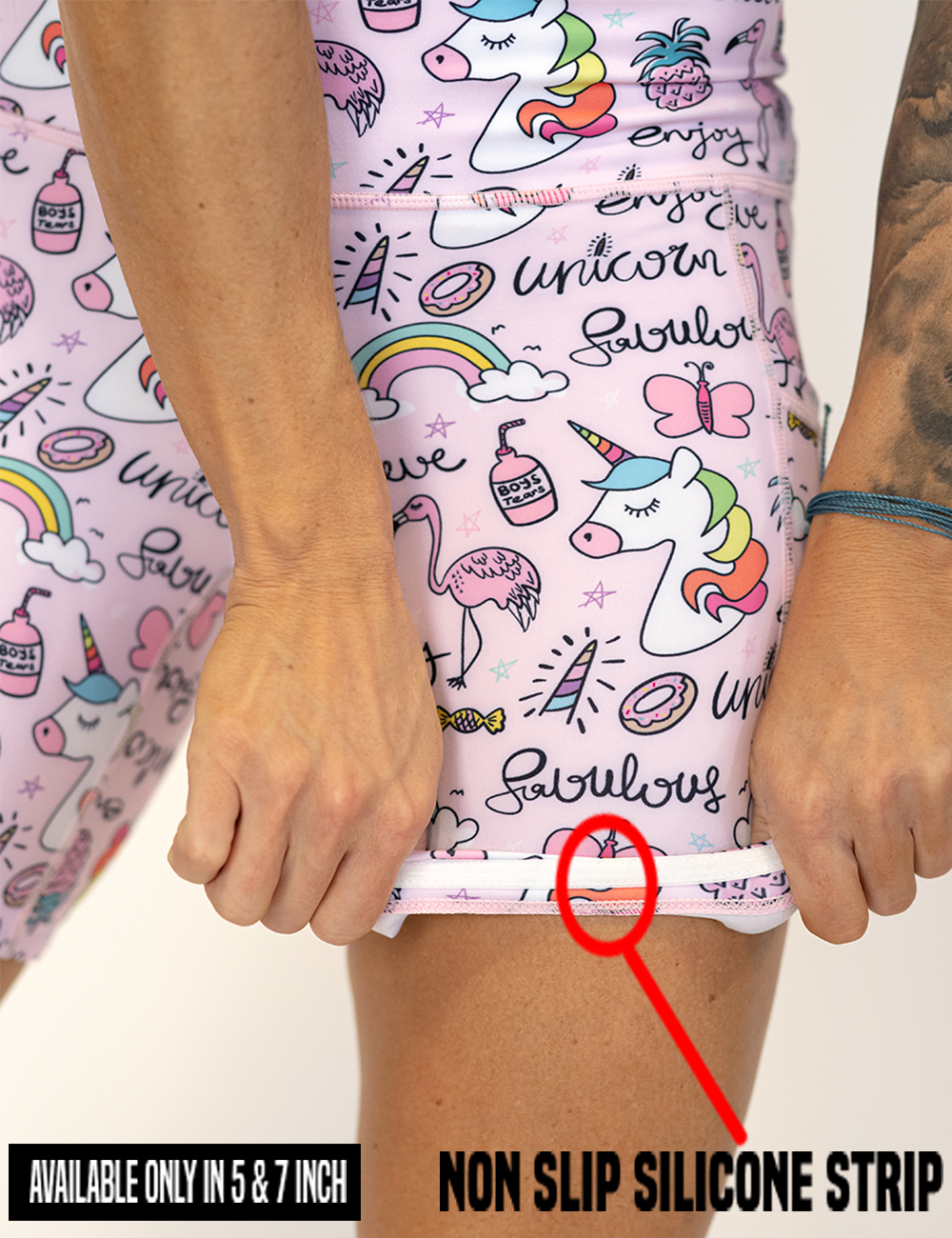 the unicorn and icons pink shorts rolled up to show the non slip silicone strip found in the lining of the 5 and 7 inch inseam shorts