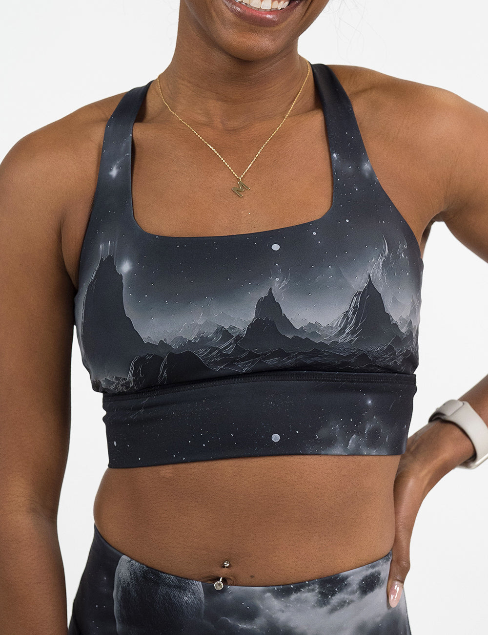 front of the black bra with a mountain and star pattern against a white background