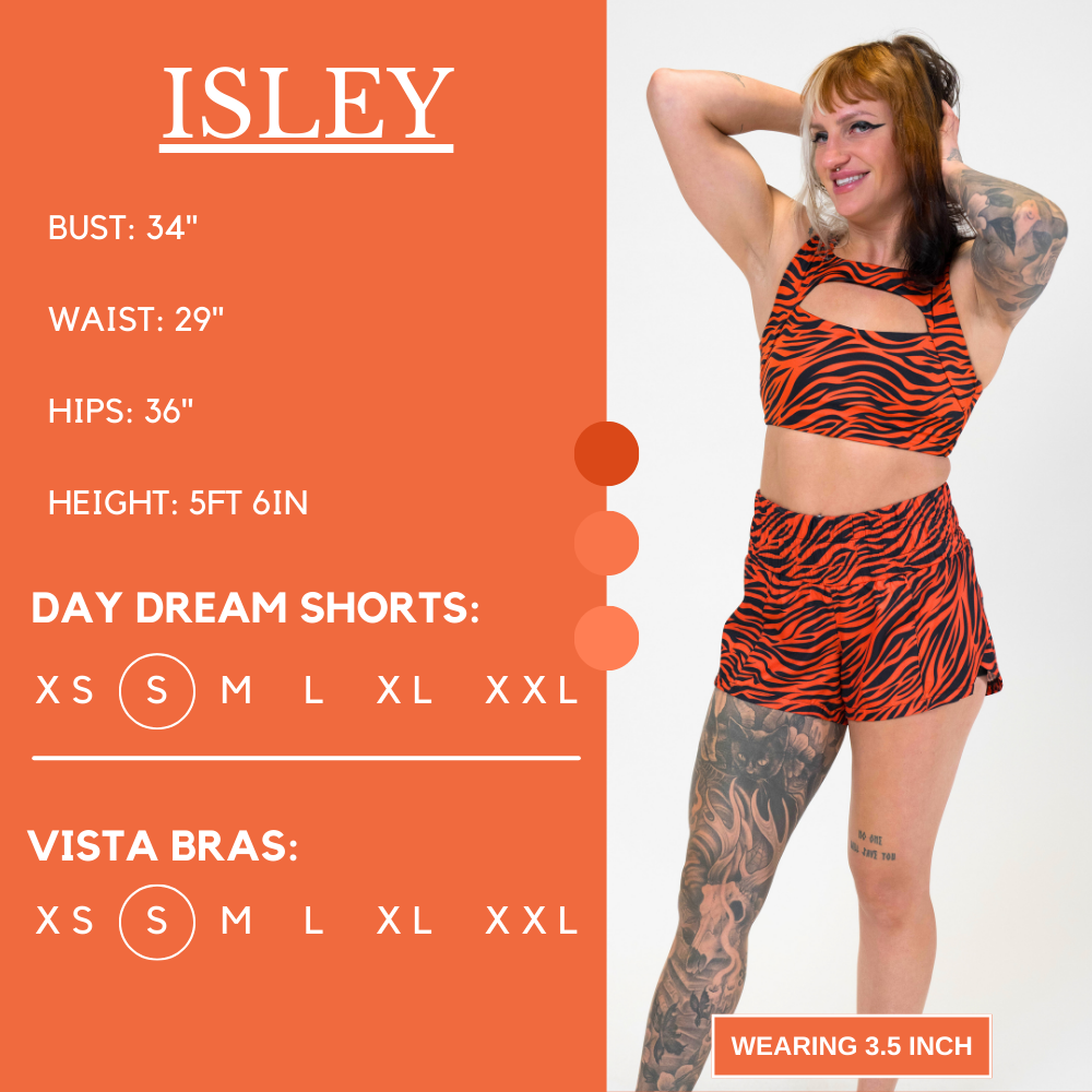 Model’s measurements of 34” bust, 29” waist, 36” hips and height of 5 ft 6 in. She is wearing a size small in our day dream shorts and a size small in our vista bra