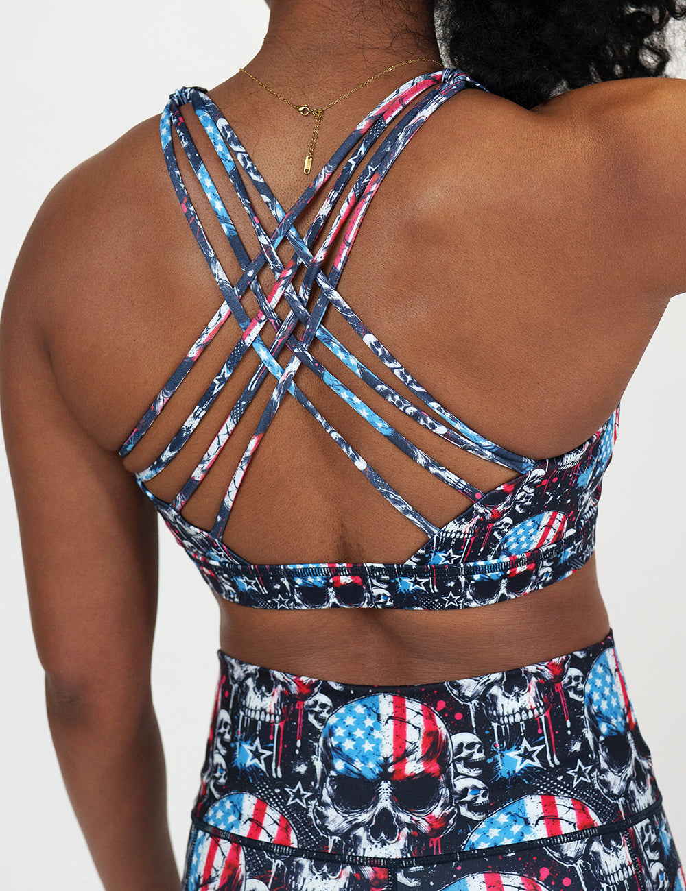 back of the black bra with American flag skulls against a white background