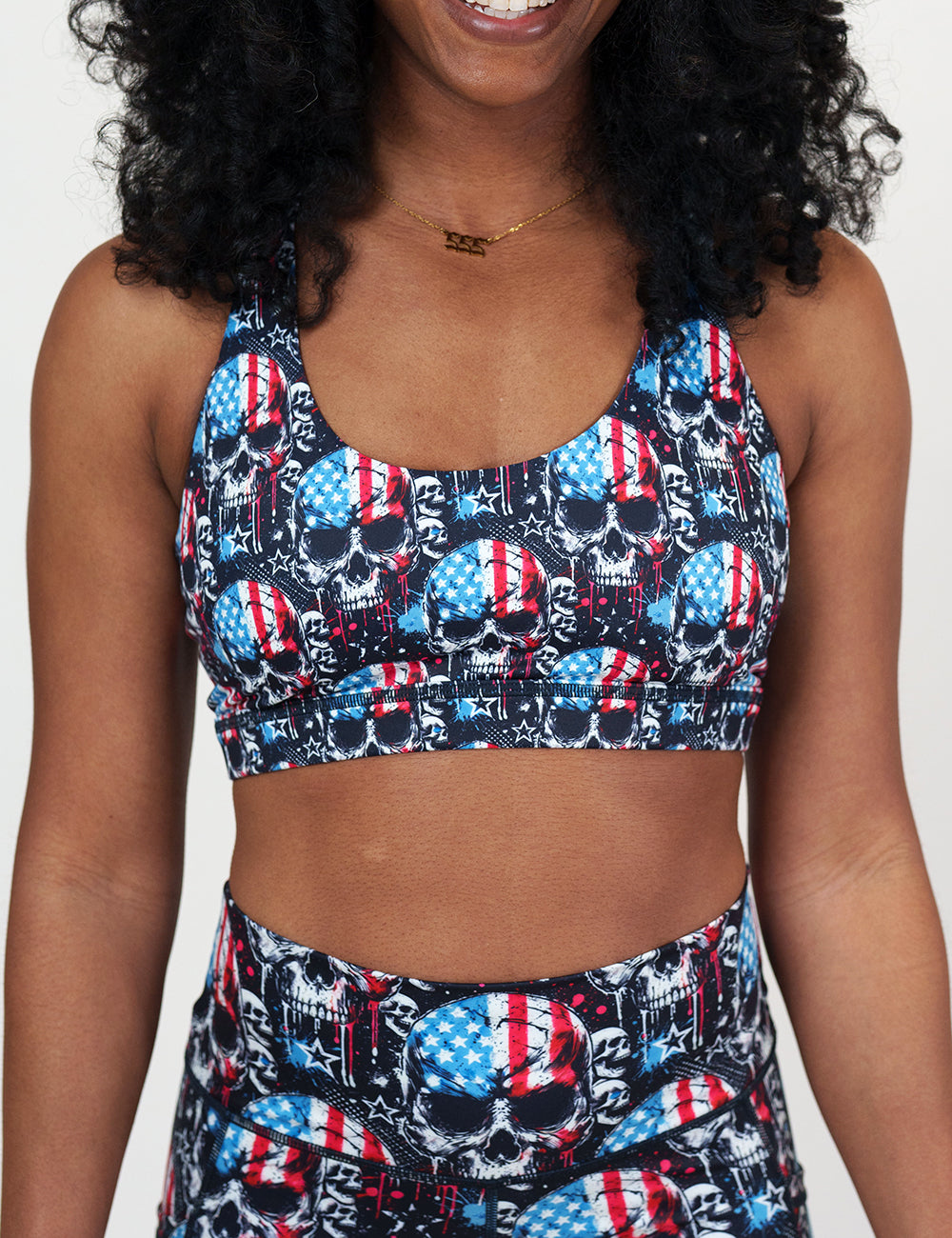 front of the black bra with American flag skulls against a white background
