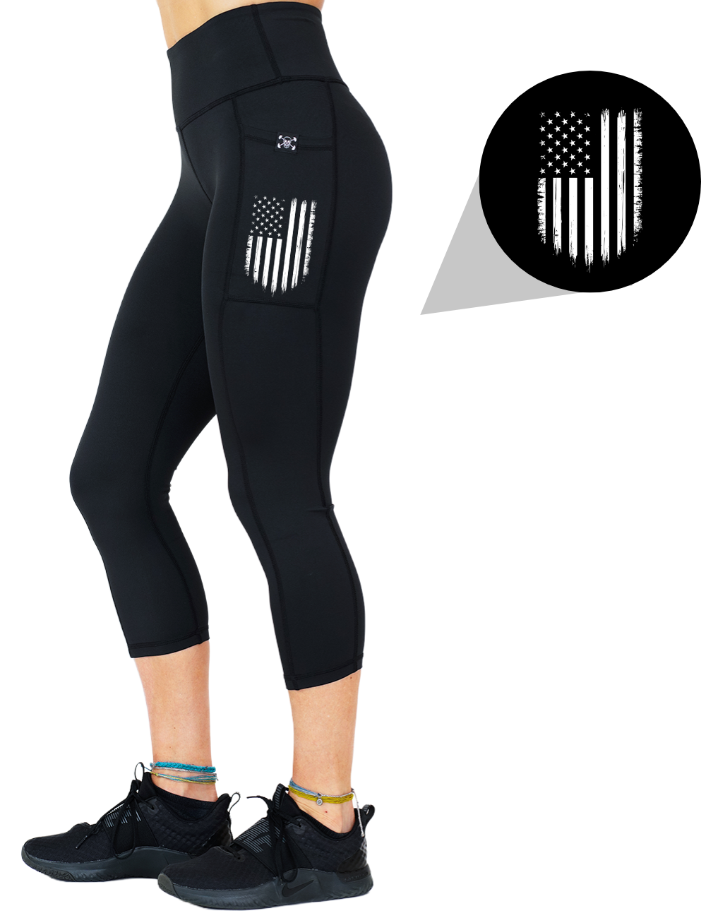 model wearing the usa flag graphic capri solid black leggings against a white background