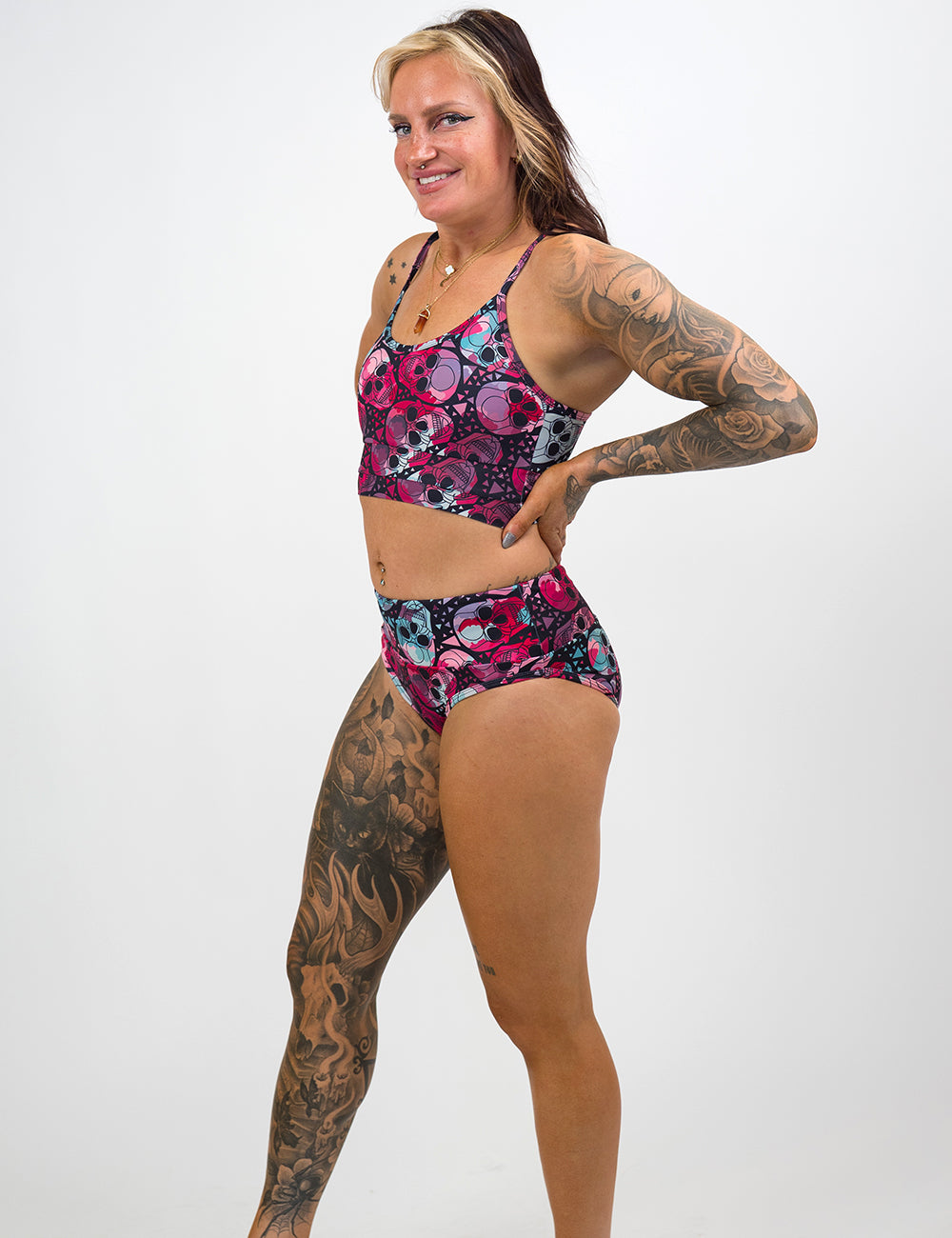 model wearing the blue and red skull pattern coastline bathing suit top and bottom against a white background