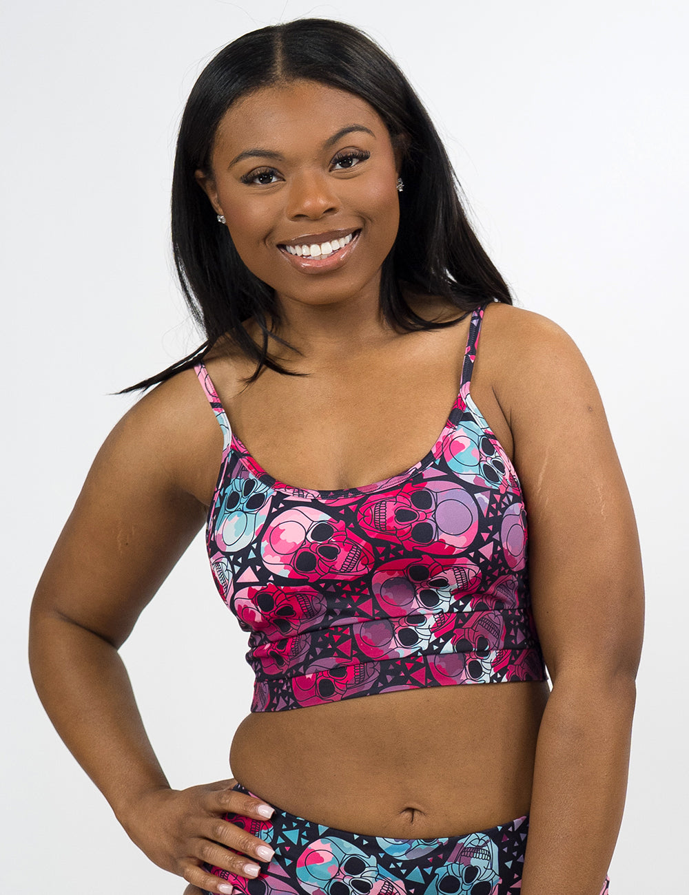 model wearing the blue and red skull pattern coastline bathing suit top against a white background
