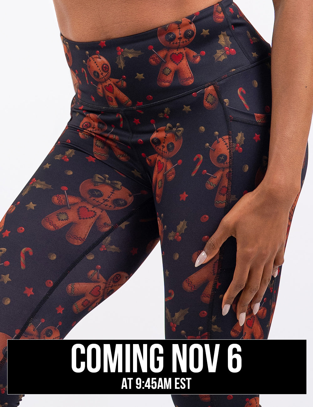 front of the gingerbread voodoo dolls with pins in them surrounded by berries and stars on a black background legging, coming November 6th