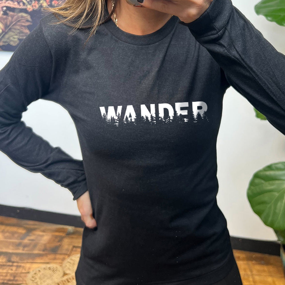 Black colored long sleeve shirt with a graphic on it that says "Wander"