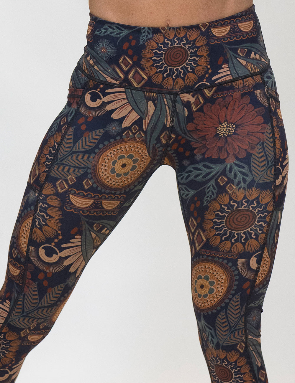 front of the paisley flowers leggings against a white background
