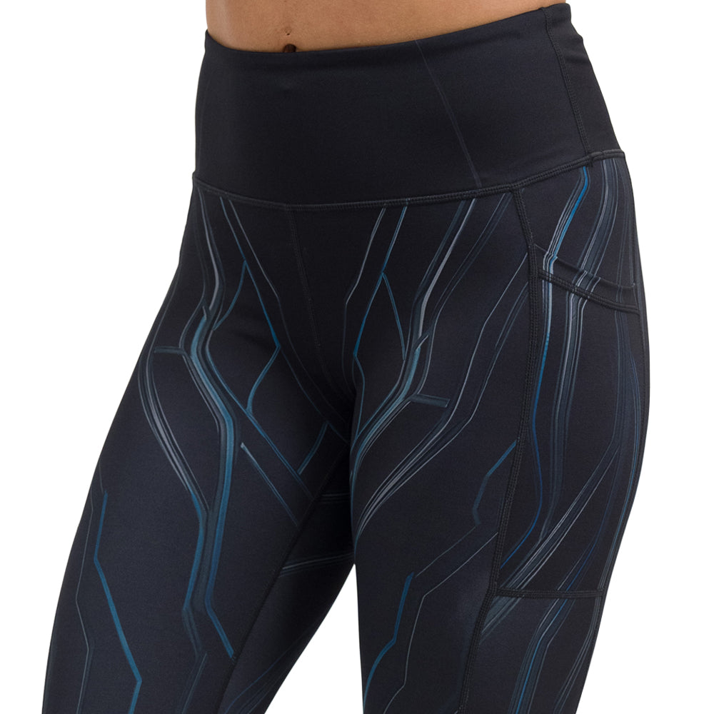 close up of the black leggings with a blue pattern against a white background